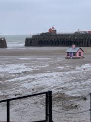 Tide's out at the little pink house in Folkestone